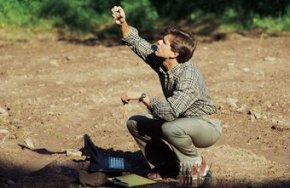 An environmental geologist tests the soil and rock to determine the environmental impact of large projects.