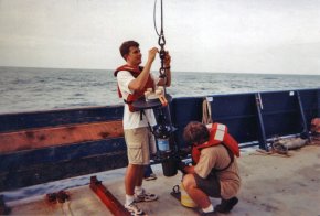 Study author Timothy Crone (left) prepares to deploy an underwater camera to record flow from natural hydrothermal vents off the U.S. Pacific northwest. Techniques used on the vents were adapted to measure oil flow in the Gulf.